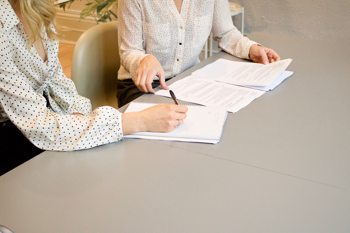 woman signing a contract